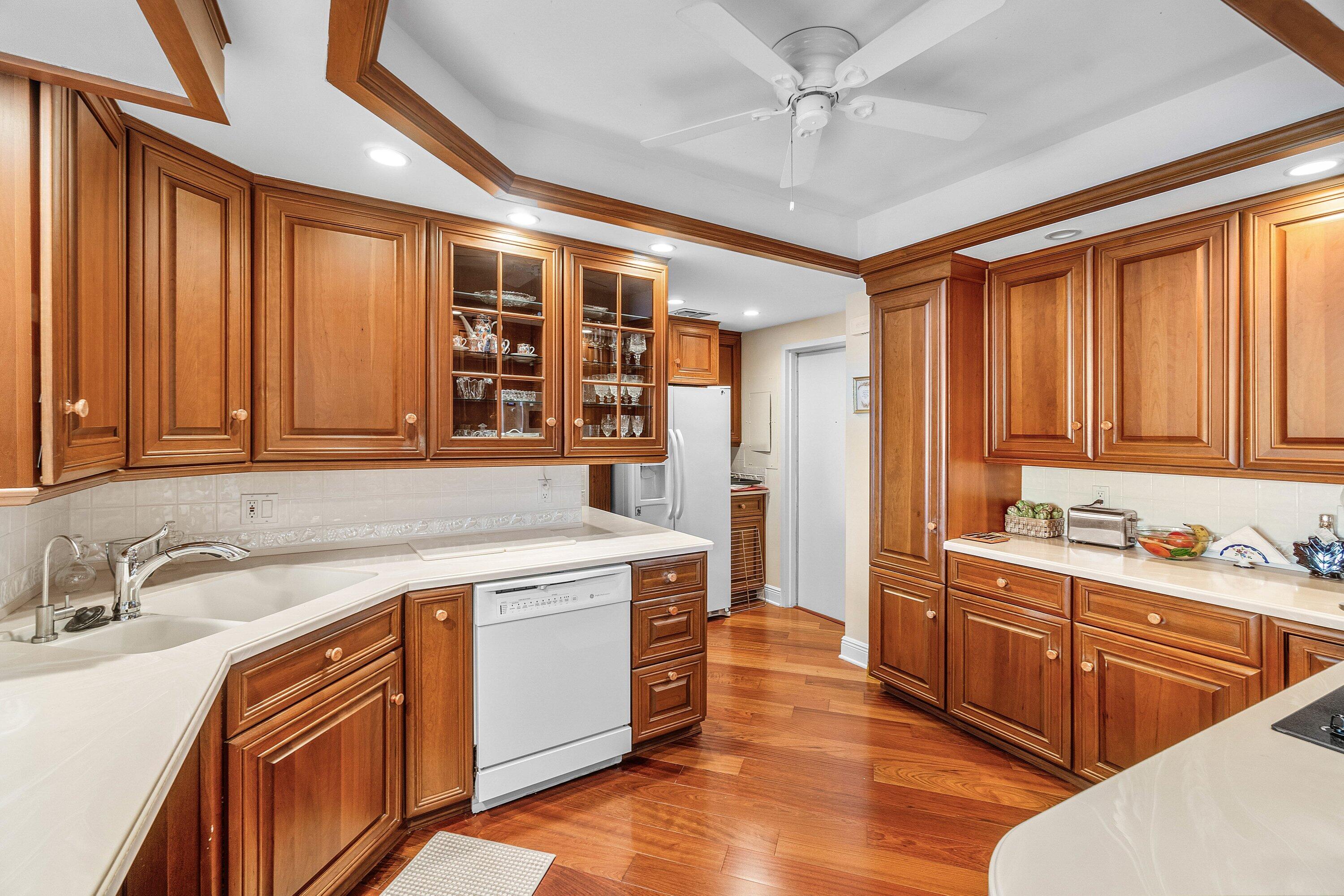 700 South Ocean Boulevard, Unit 804 Boca Raton, FL 33432 - Photo 11 of 39 a kitchen that has a sink and a stove in it