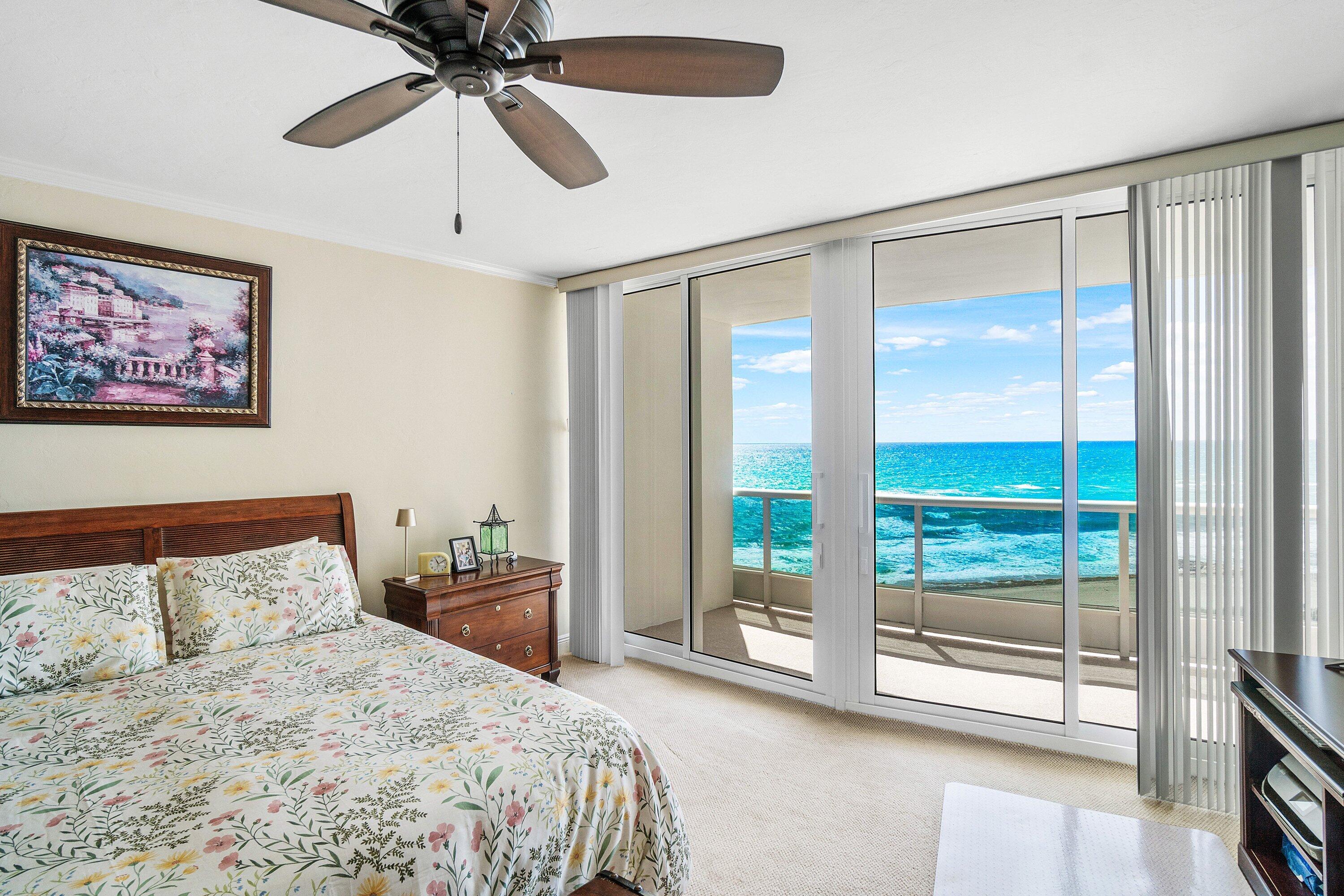 700 South Ocean Boulevard, Unit 804 Boca Raton, FL 33432 - Photo 18 of 39 a bedroom with a large bed and a tv