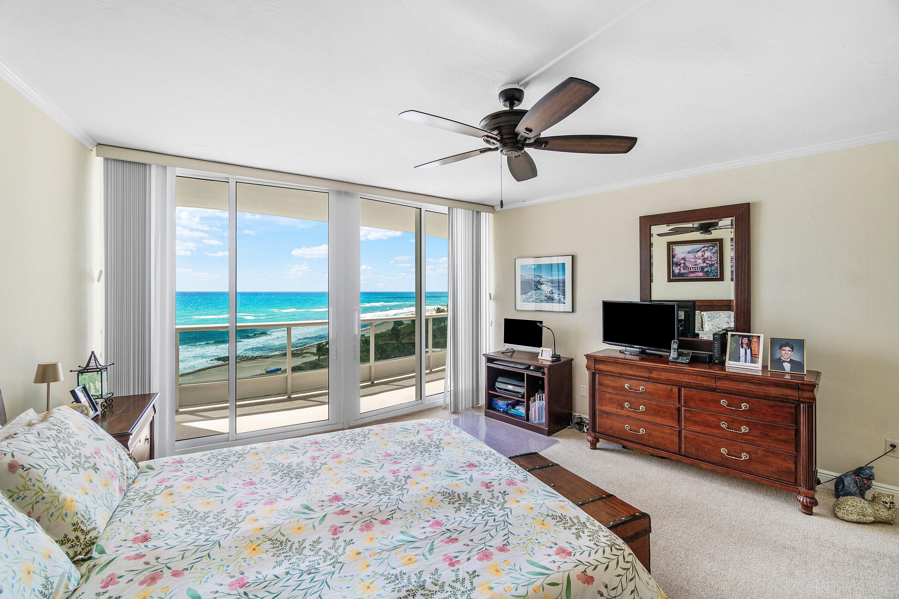 700 South Ocean Boulevard, Unit 804 Boca Raton, FL 33432 - Photo 19 of 39 a living room with a bed furniture and a flat tv screen