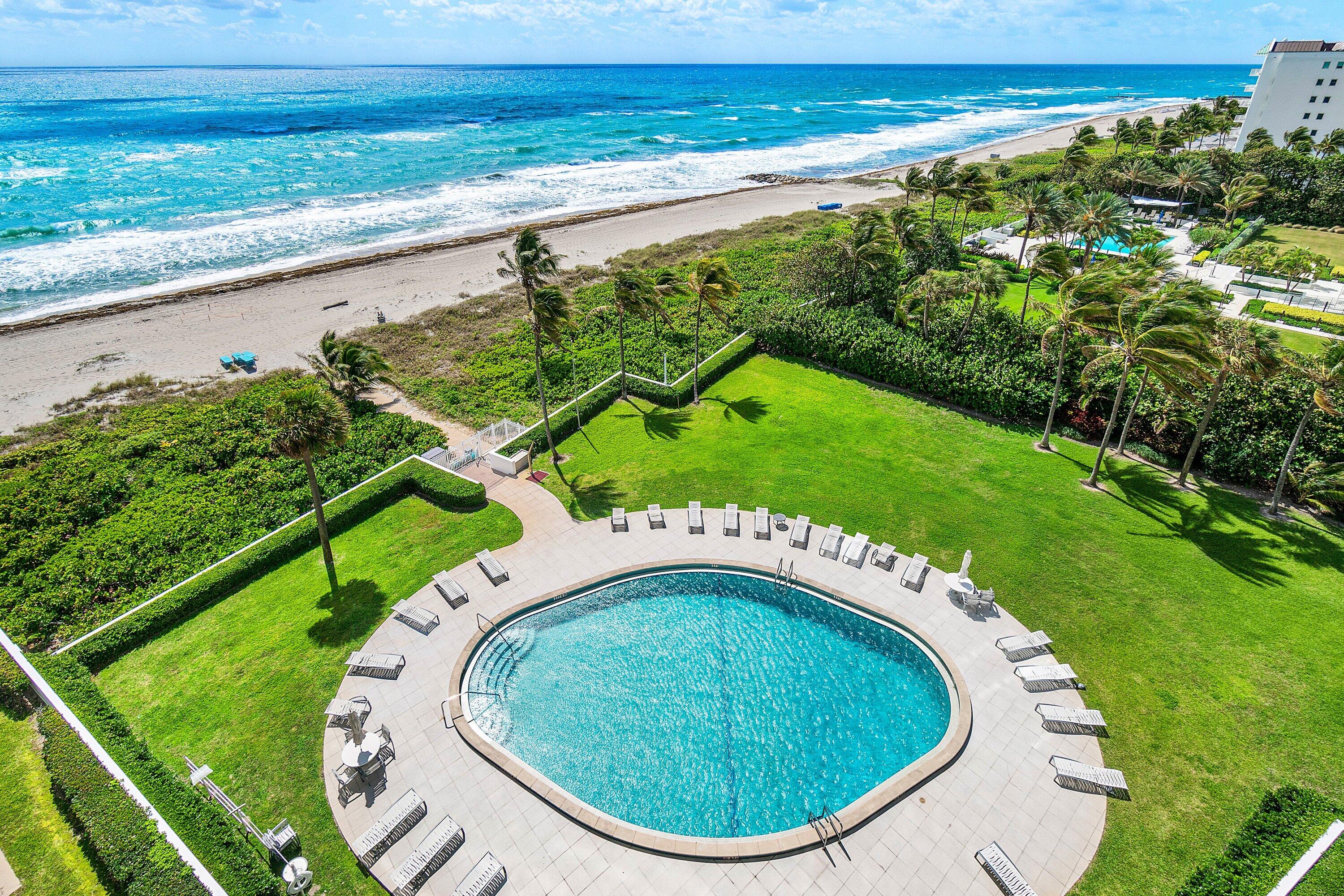 700 South Ocean Boulevard, Unit 804 Boca Raton, FL 33432 - Photo 24 of 39 a view of a swimming pool with a yard