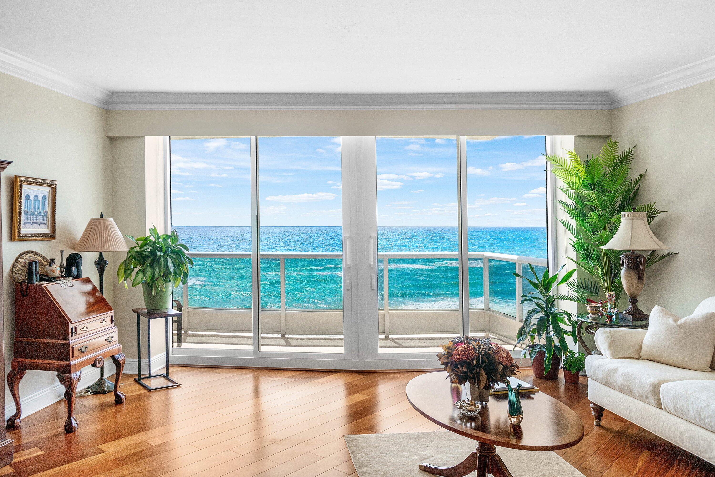 700 South Ocean Boulevard, Unit 804 Boca Raton, FL 33432 - Photo 3 of 39 a living room with furniture and a large window with garden view