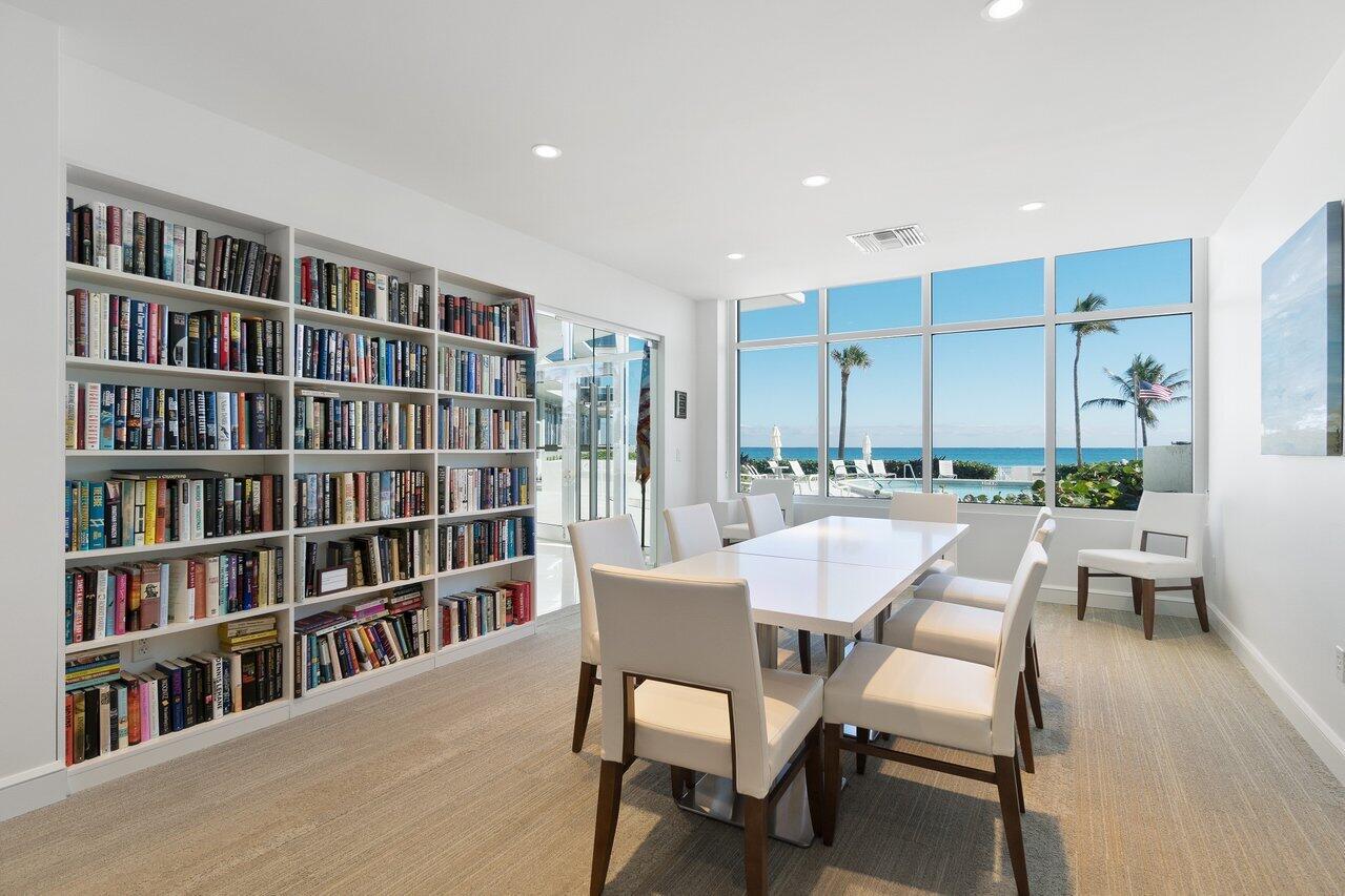 700 South Ocean Boulevard, Unit 804 Boca Raton, FL 33432 - Photo 35 of 39 a dining room with furniture and a book shelf