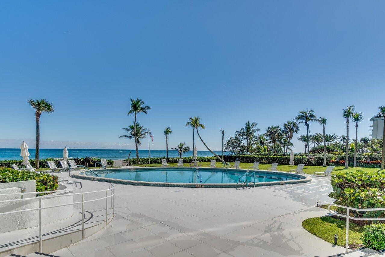 700 South Ocean Boulevard, Unit 804 Boca Raton, FL 33432 - Photo 36 of 39 a view of a house with a yard and a garden