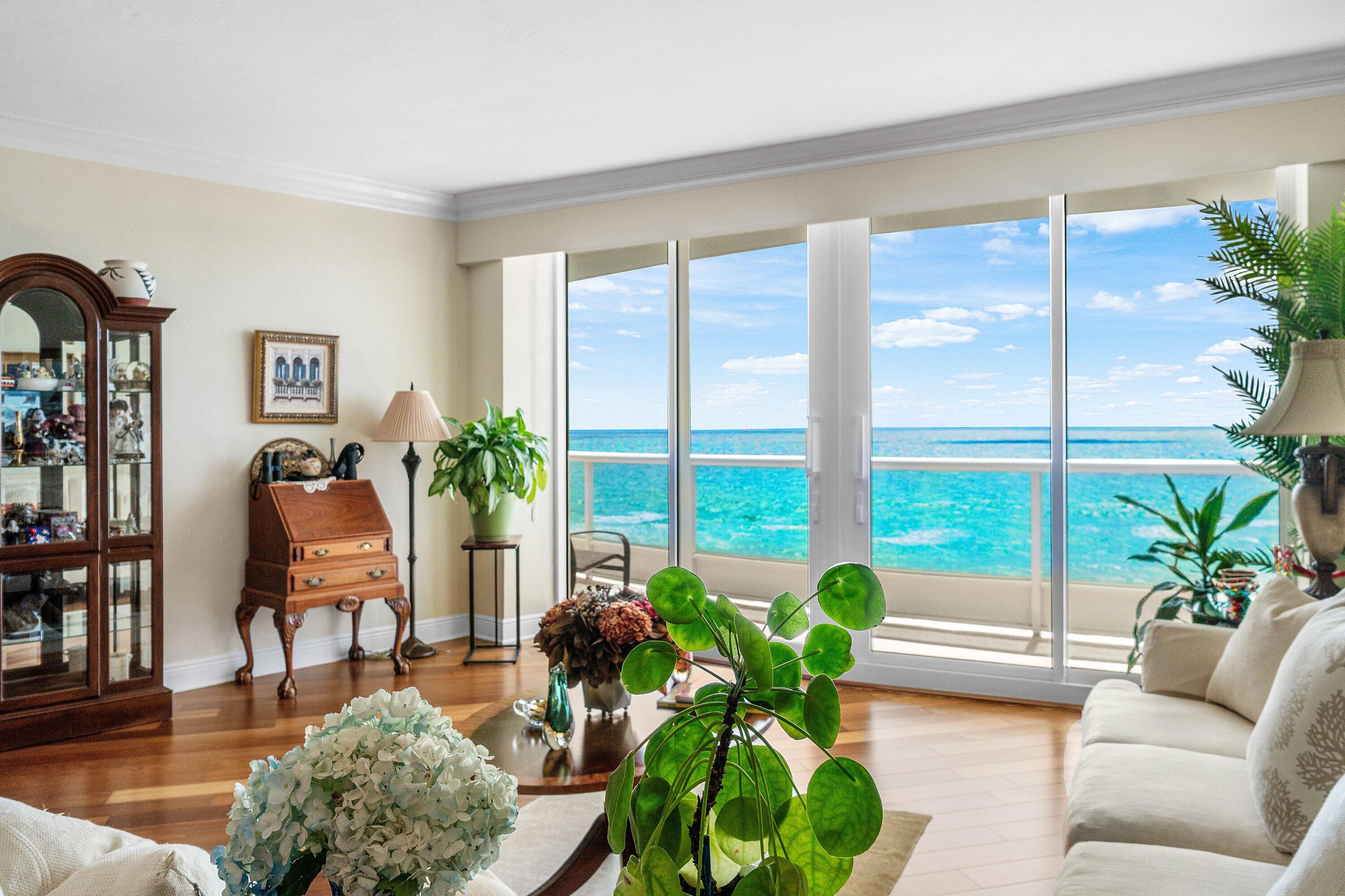 700 South Ocean Boulevard, Unit 804 Boca Raton, FL 33432 - Photo 4 of 39 a living room filled with furniture and a large window