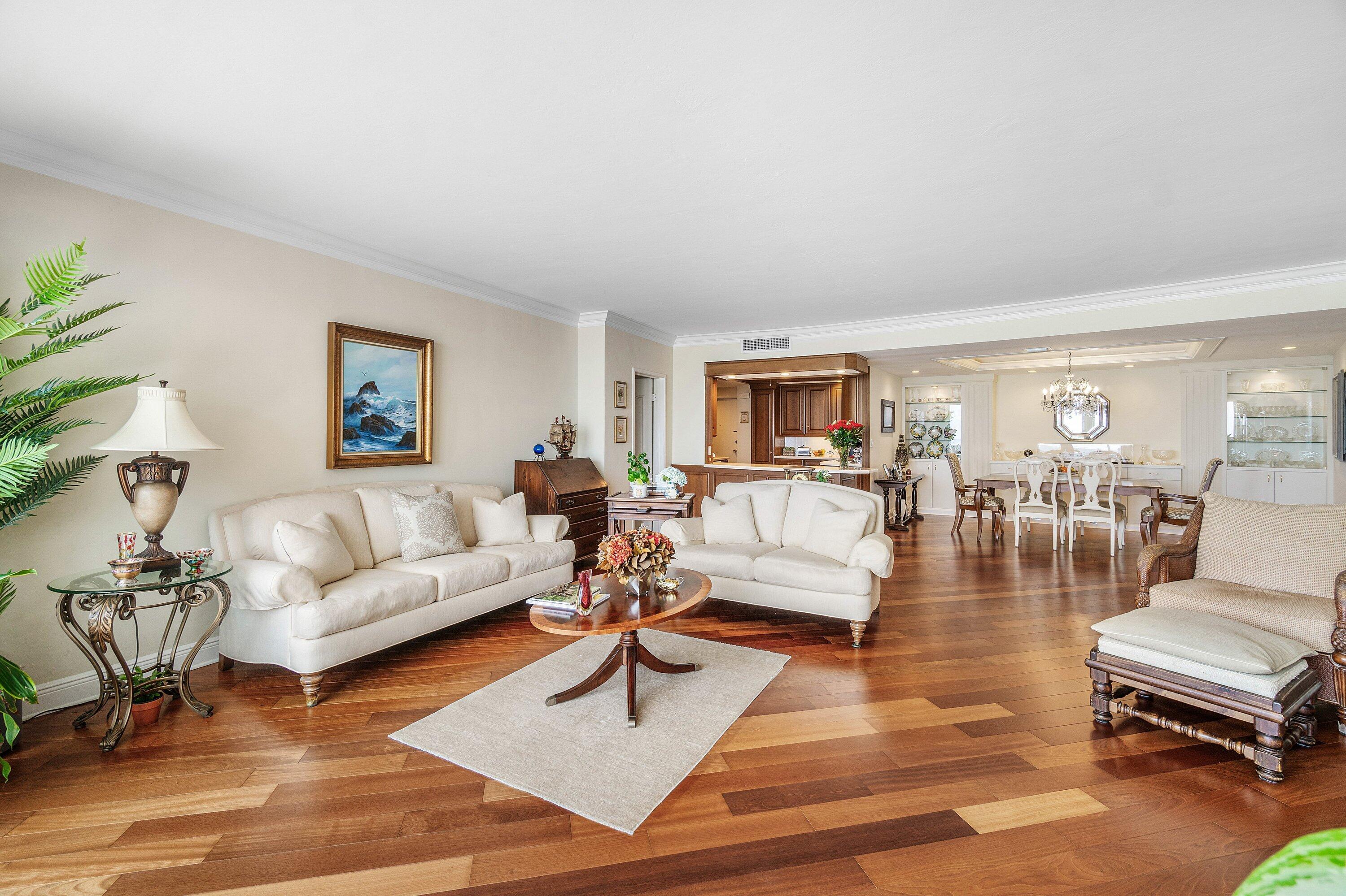 700 South Ocean Boulevard, Unit 804 Boca Raton, FL 33432 - Photo 6 of 39 a living room with furniture and wooden floor