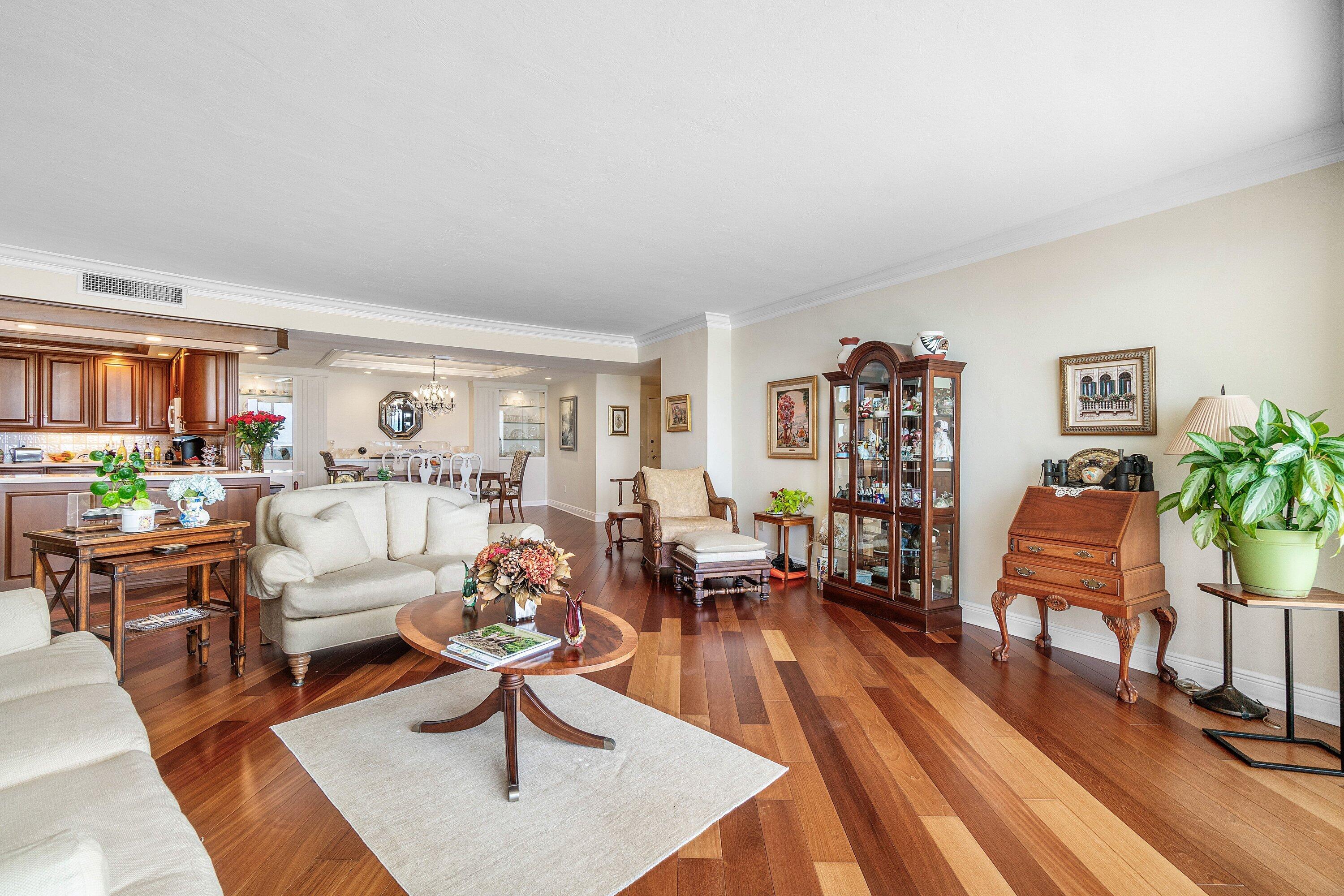 700 South Ocean Boulevard, Unit 804 Boca Raton, FL 33432 - Photo 7 of 39 a living room with furniture and a wooden floor