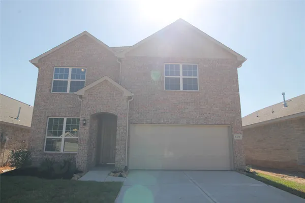 a front view of a house with garage