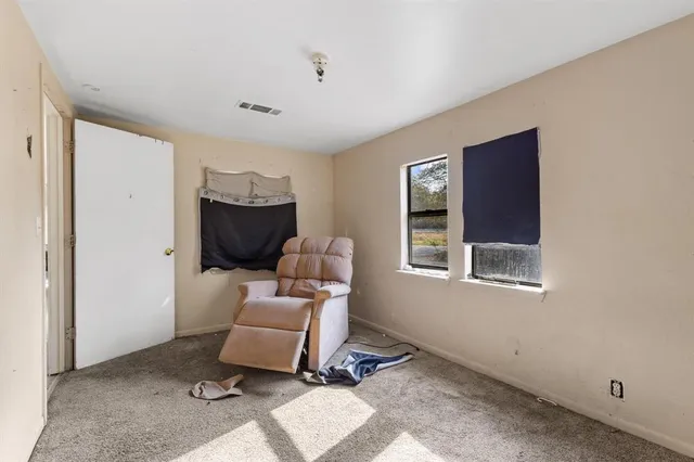 a living room with a couch and a window