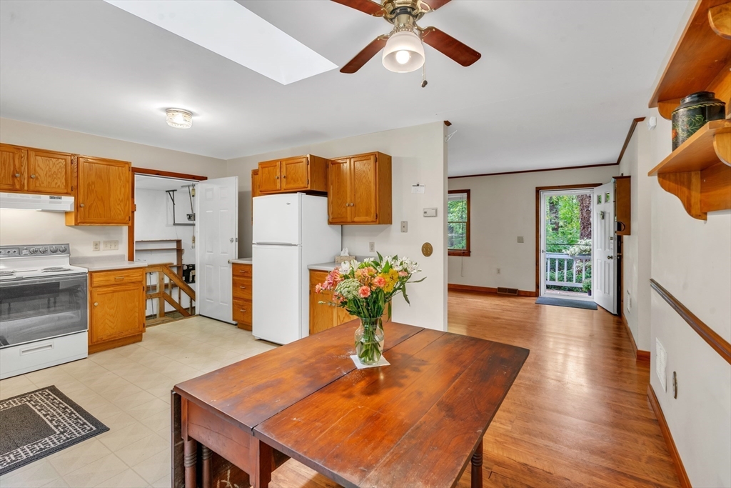 30 Montague Road Sunderland, MA 01375 - Photo 12 of 39 a view of a dining room kitchen with furniture and wooden floor