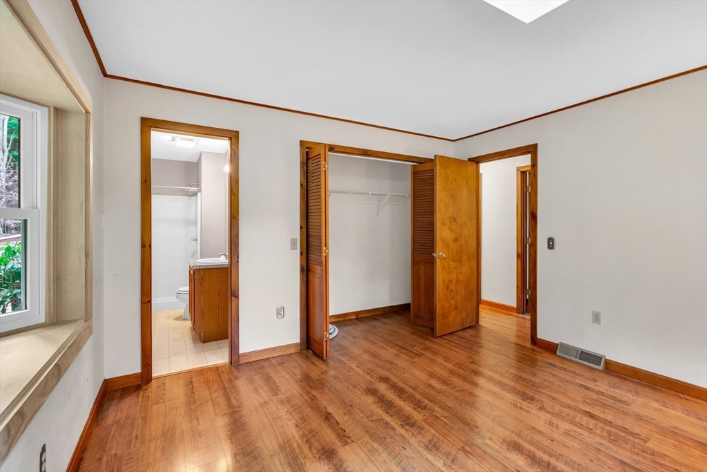 30 Montague Road Sunderland, MA 01375 - Photo 21 of 39 an empty room with wooden floor and windows