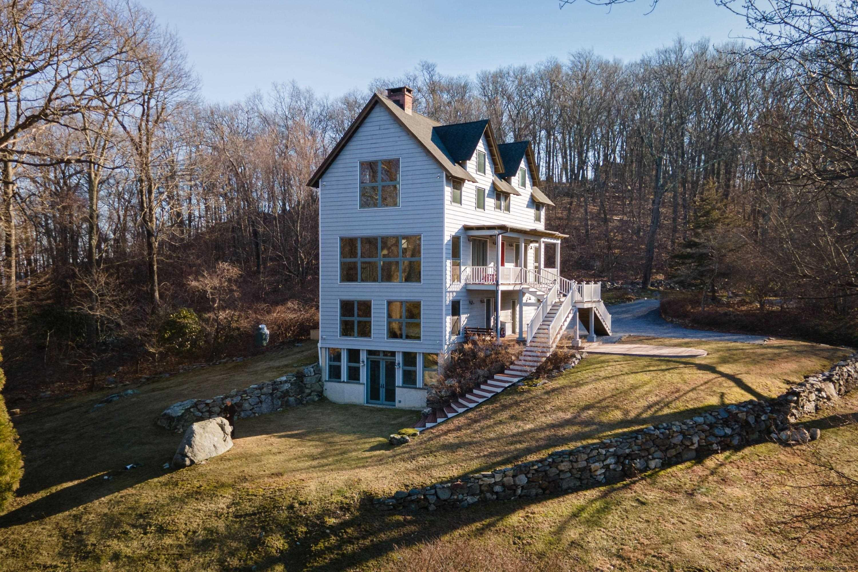 21 Private Way Garrison, NY 10524 - Photo 1 of 35 a front view of a house with a yard