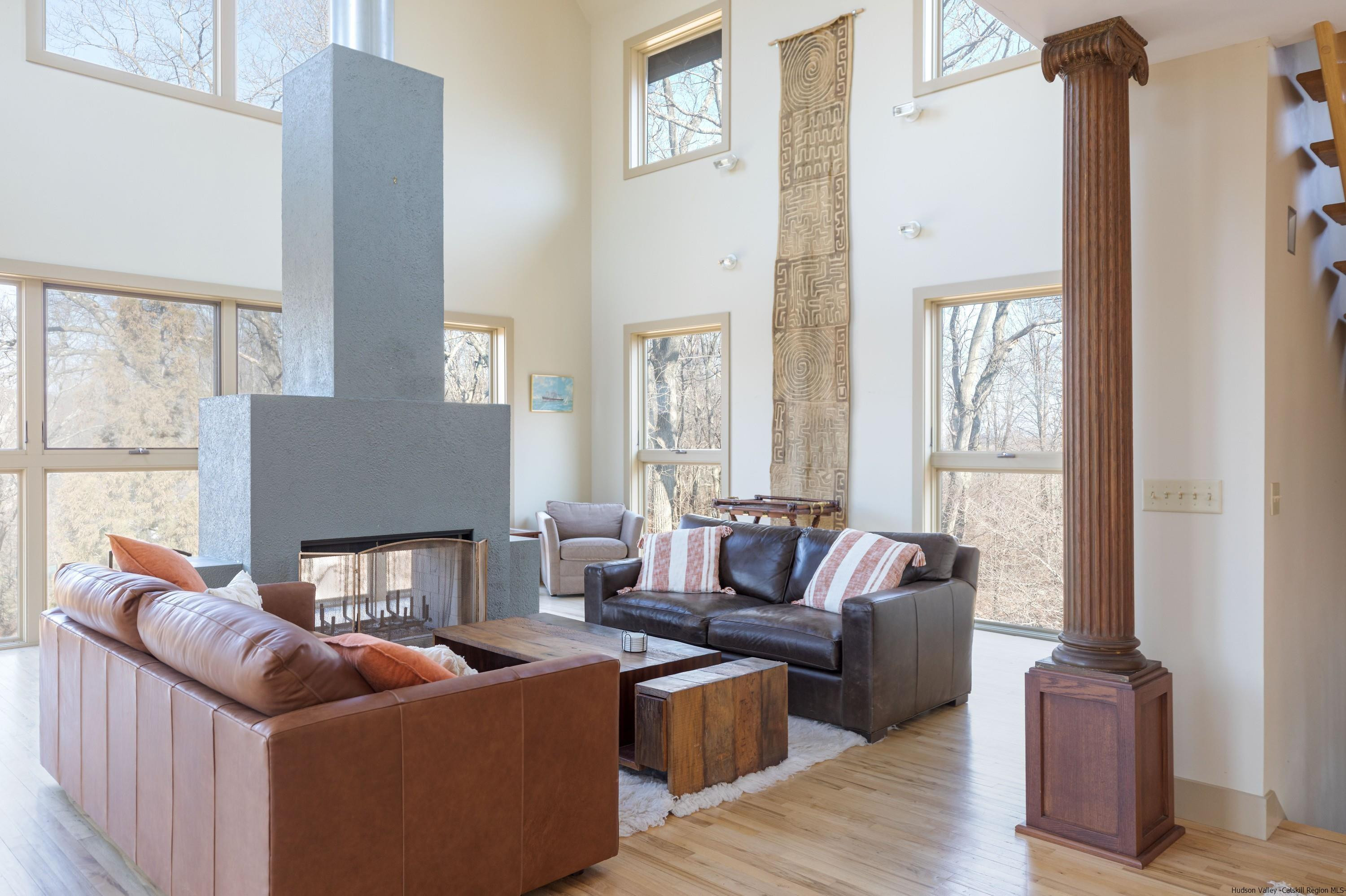 21 Private Way Garrison, NY 10524 - Photo 12 of 35 a living room with furniture fireplace and a large window