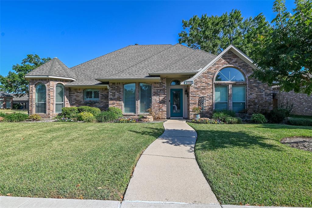 100 Cherrybark Drive Coppell, TX 75019 - Photo 1 of 1 a front view of a house with yard and green space