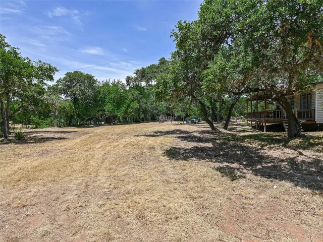 a backyard of a house with lots of green space