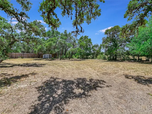 a view of outdoor space with trees all around