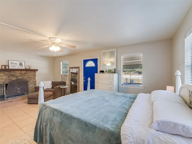 a bed room with a bed and a chandelier