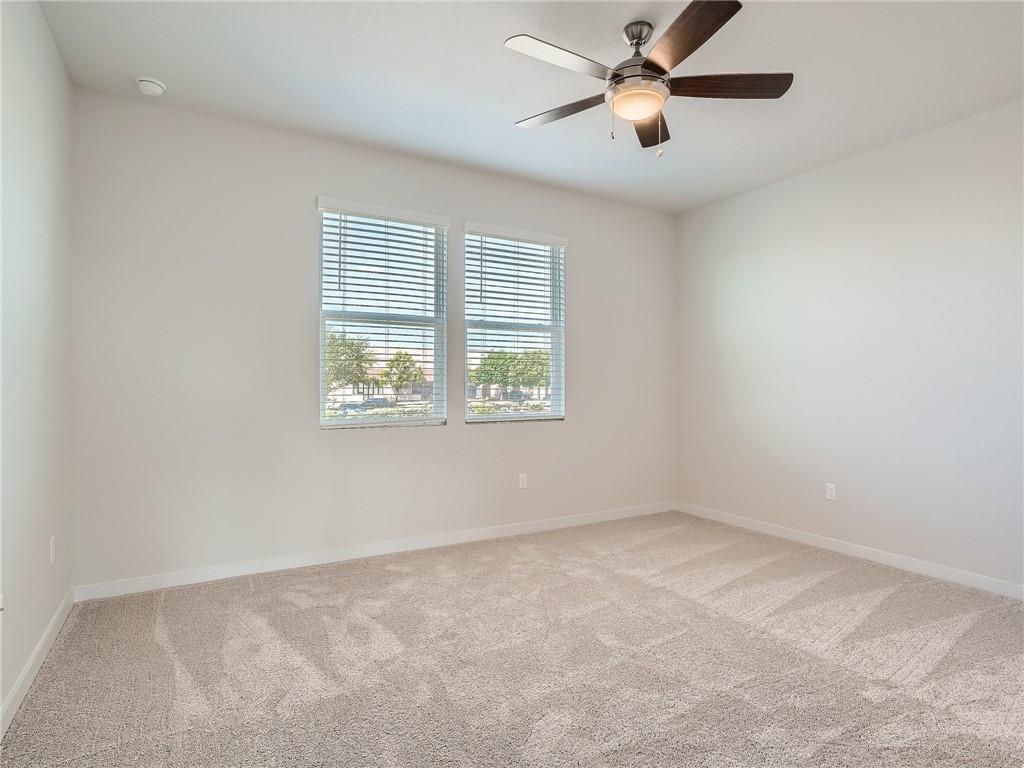 1309 Showbox Street, Unit 6 Pflugerville, TX 78660 - Photo 12 of 24 a view of an empty room with a window