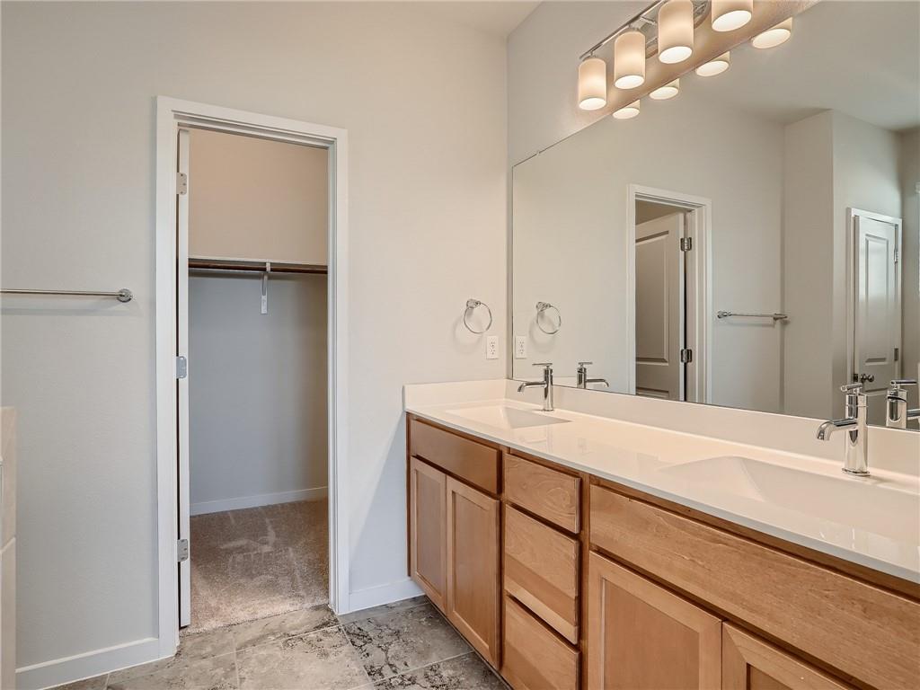 1309 Showbox Street, Unit 6 Pflugerville, TX 78660 - Photo 16 of 24 a bathroom with a sink double vanity and a mirror