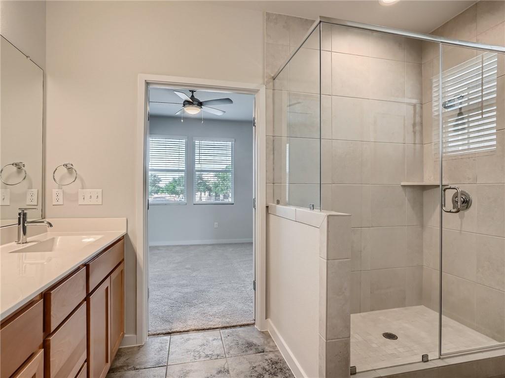 1309 Showbox Street, Unit 6 Pflugerville, TX 78660 - Photo 17 of 24 a bathroom with a shower sink and vanity