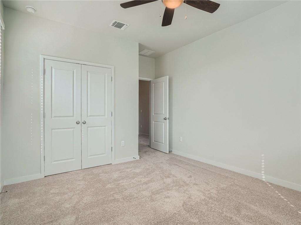 1309 Showbox Street, Unit 6 Pflugerville, TX 78660 - Photo 19 of 24 an empty room with ceiling fan