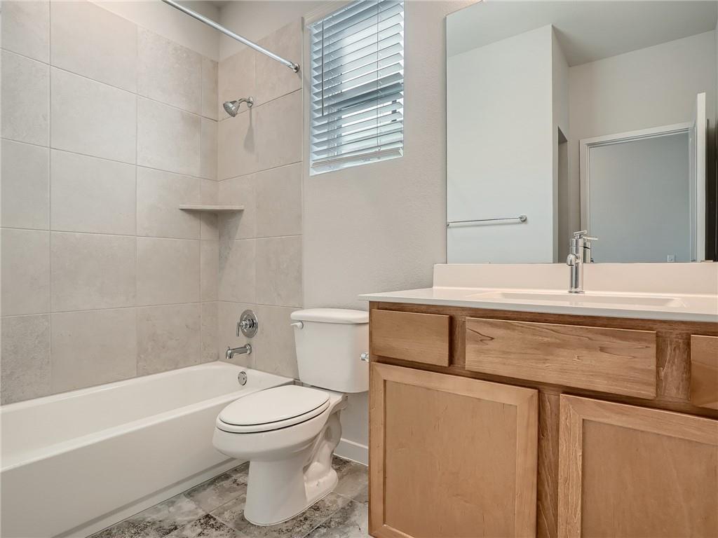 1309 Showbox Street, Unit 6 Pflugerville, TX 78660 - Photo 20 of 24 a bathroom with a sink toilet and shower