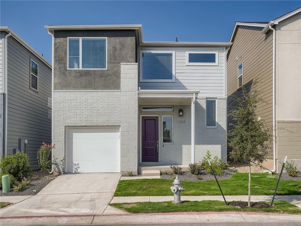 1309 Showbox Street, Unit 6 Pflugerville, TX 78660 - Photo 2 of 24 a front view of a house with a garden and plants