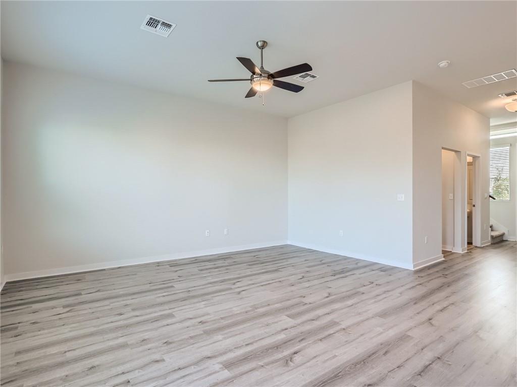 1309 Showbox Street, Unit 6 Pflugerville, TX 78660 - Photo 5 of 24 a view of empty room with wooden floor