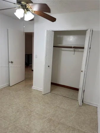 a view of an empty room with a fireplace