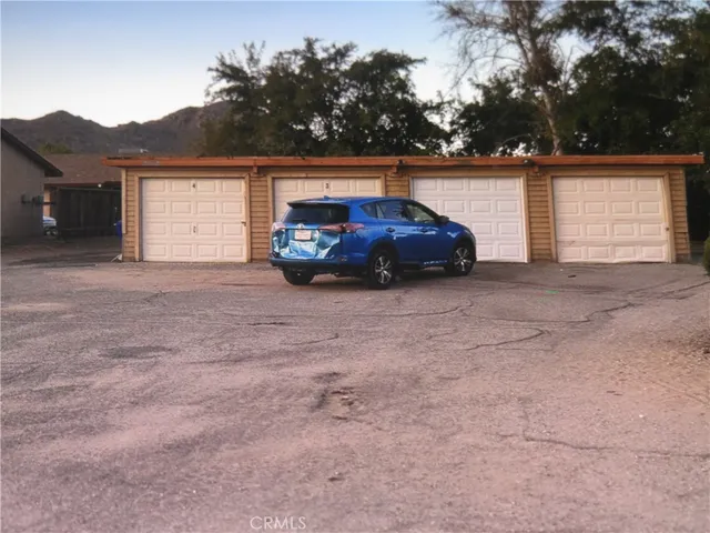 a view of a car in front of a house