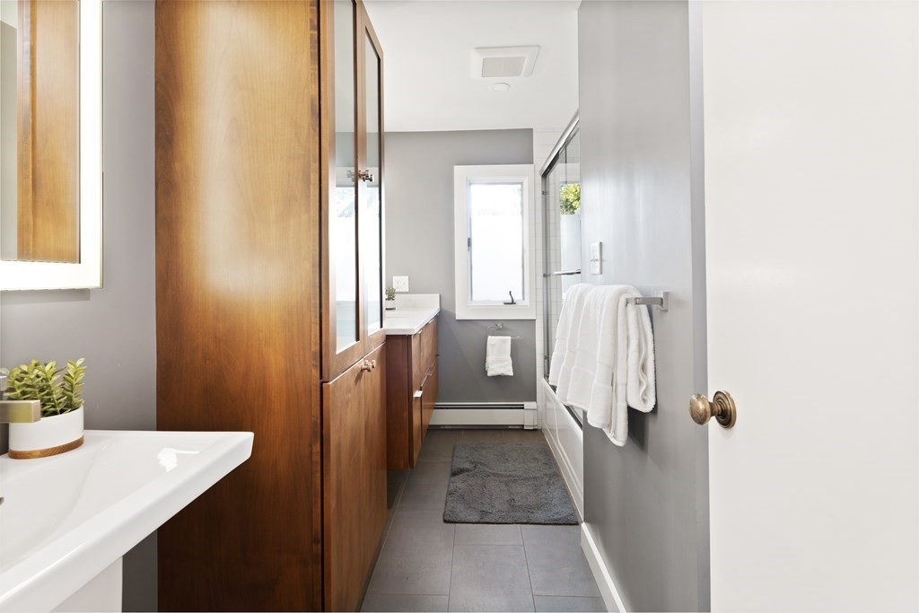 4 Lantern Lane Lexington, MA 02421 - Photo 12 of 29 a view of a bathroom from a hallway