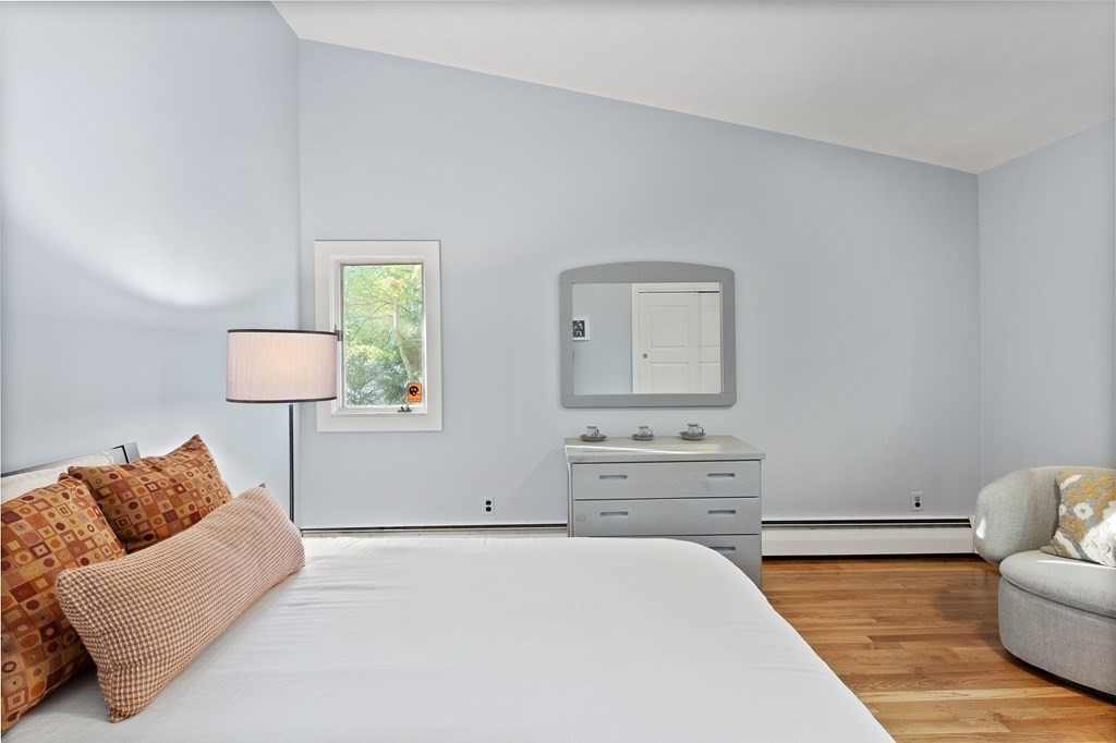 4 Lantern Lane Lexington, MA 02421 - Photo 15 of 29 a bedroom with a bed and couch