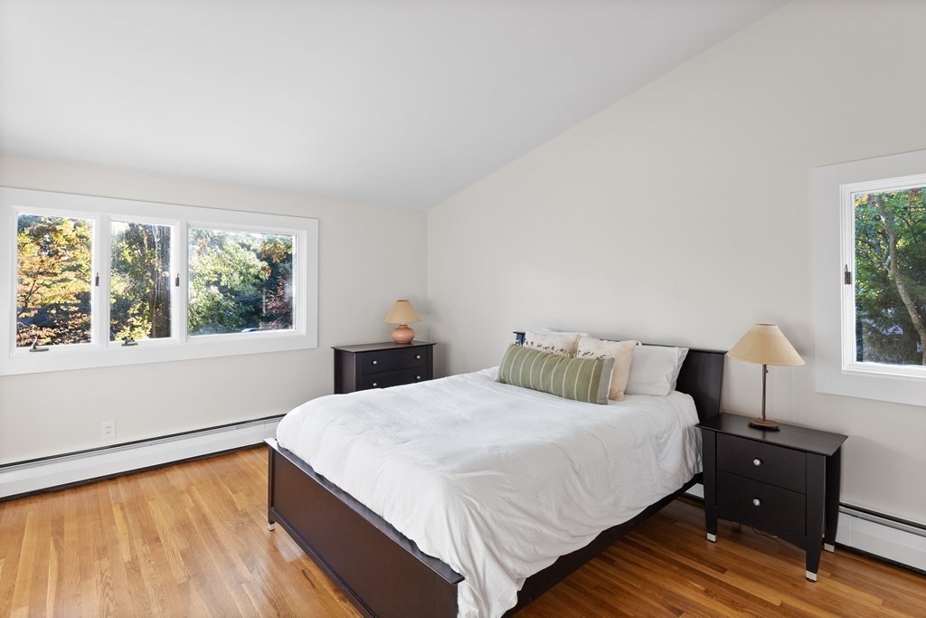 4 Lantern Lane Lexington, MA 02421 - Photo 17 of 29 a bedroom with a bed and windows