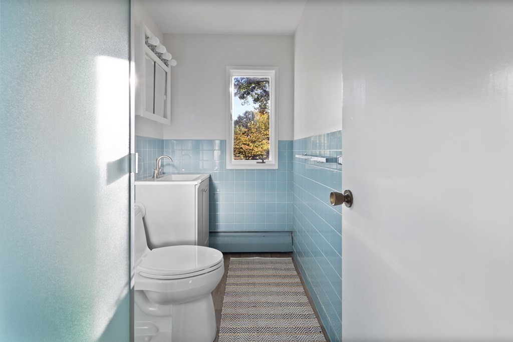 4 Lantern Lane Lexington, MA 02421 - Photo 19 of 29 a bathroom with a toilet and a shower