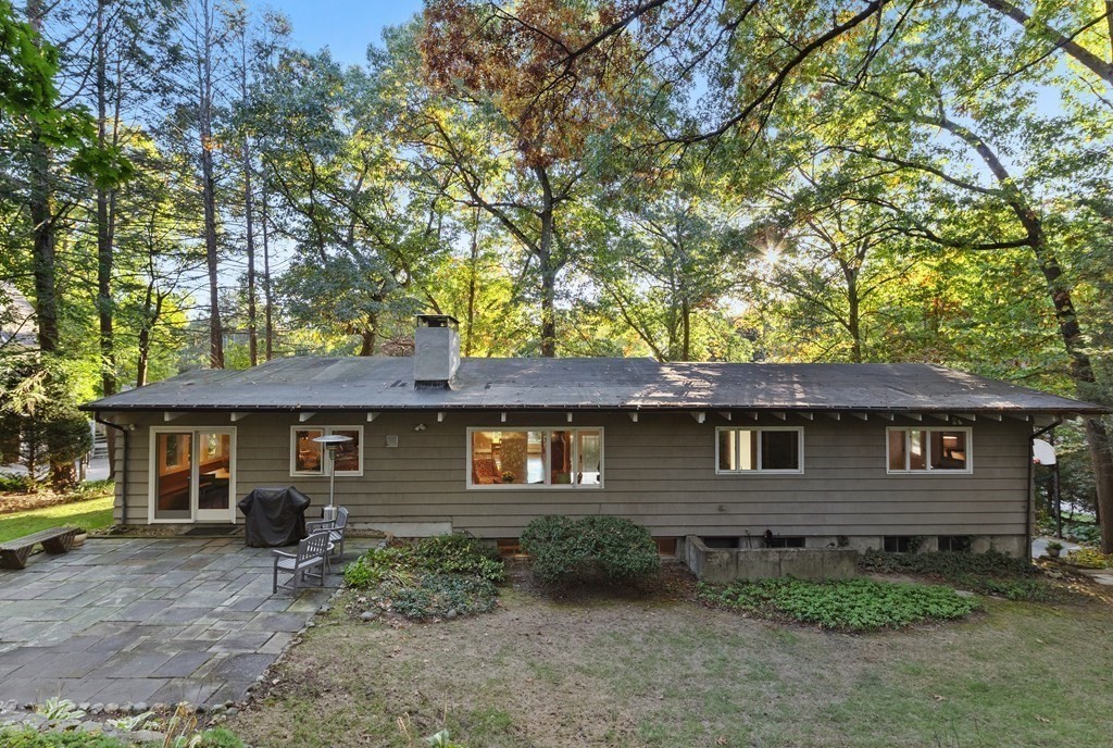 4 Lantern Lane Lexington, MA 02421 - Photo 26 of 29 a front view of a house with garden