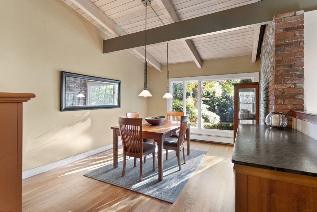 4 Lantern Lane Lexington, MA 02421 - Photo 4 of 29 a dining room with wooden floor a chandelier a glass table and chairs