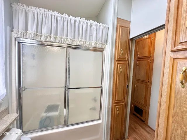 a bathroom with a toilet a sink and a mirror