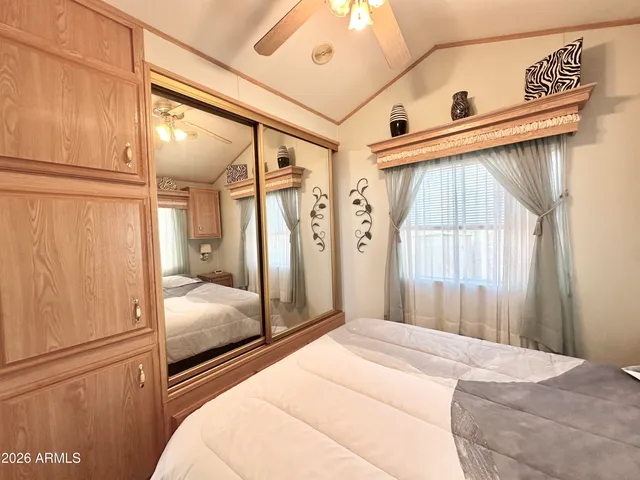 a bedroom with a bed and a closet