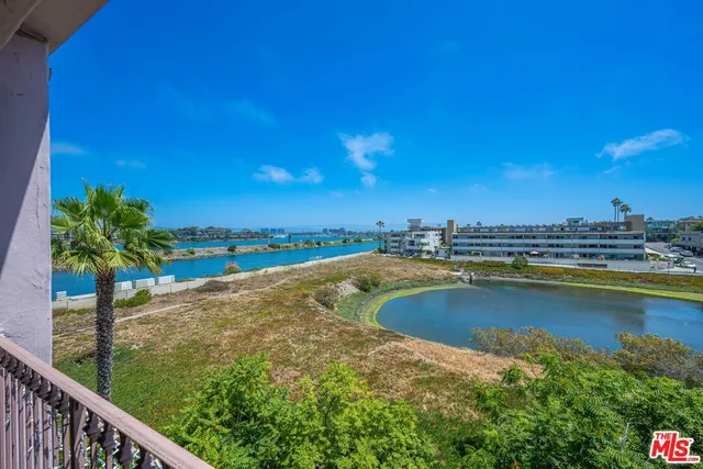 a view of a swimming pool from a balcony