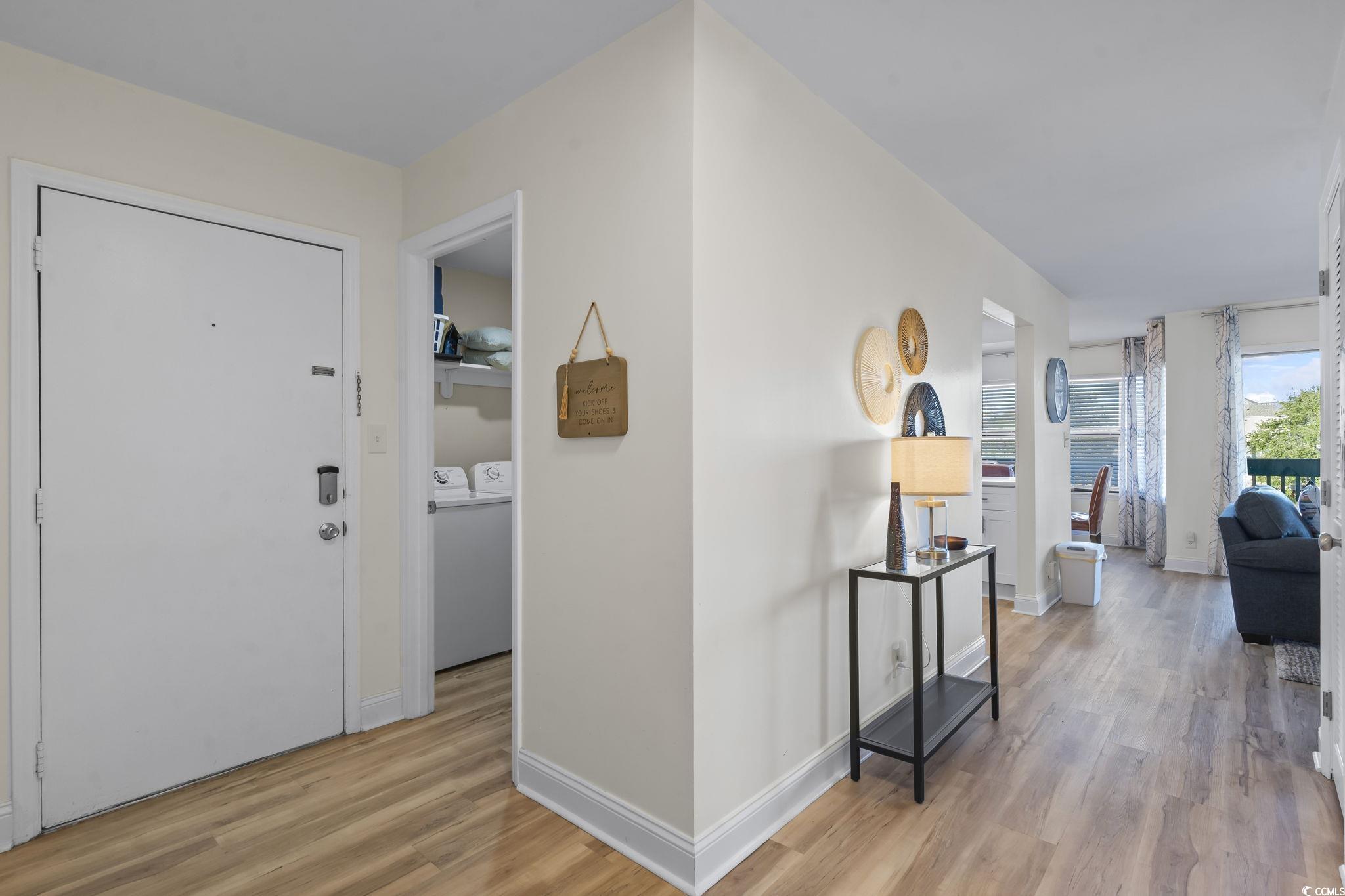 310 3rd Avenue North, Unit A2 Surfside Beach, SC 29575 - Photo 15 of 40 Hall featuring light wood-style flooring and separate washer and dryer