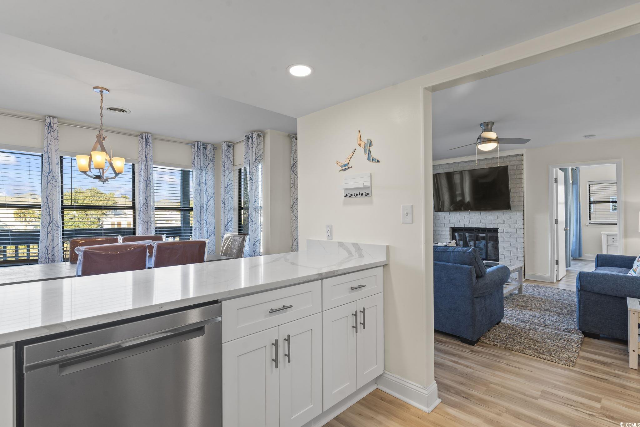 310 3rd Avenue North, Unit A2 Surfside Beach, SC 29575 - Photo 40 of 40 Kitchen with dishwasher, open floor plan, white cabinets, and recessed lighting