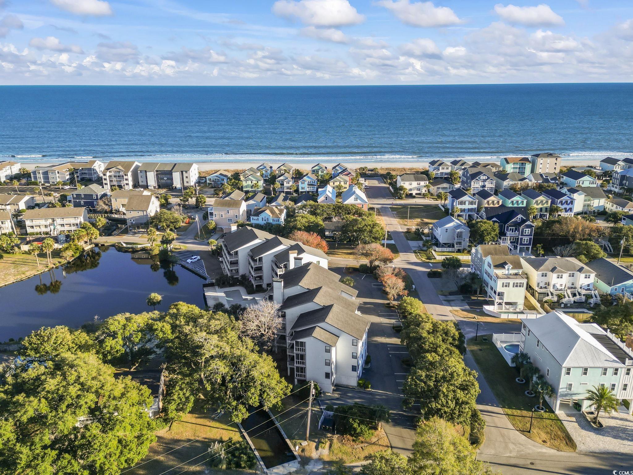 310 3rd Avenue North, Unit A2 Surfside Beach, SC 29575 - Photo 34 of 40 Aerial perspective of suburban area featuring a nearby body of water