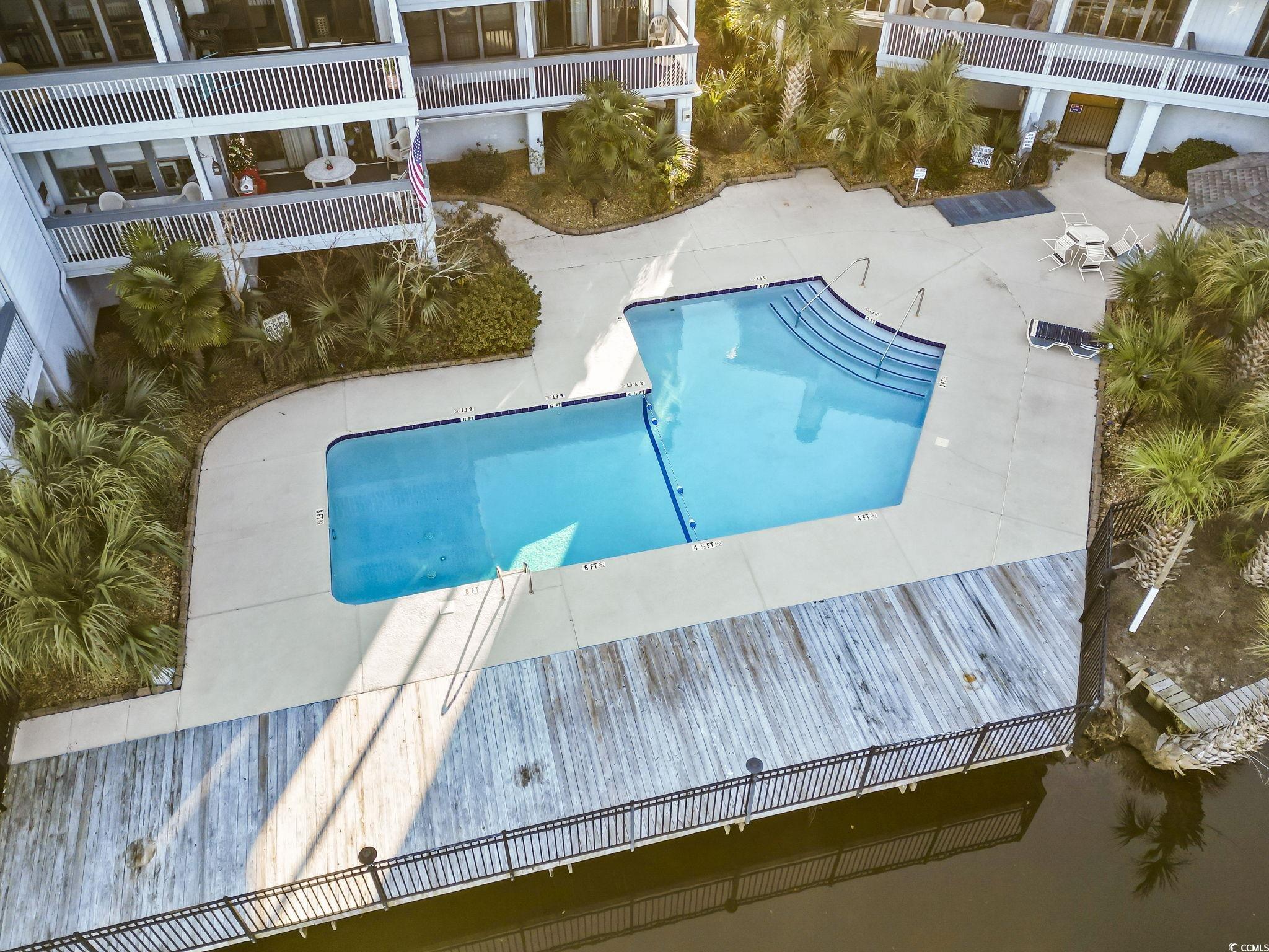 310 3rd Avenue North, Unit A2 Surfside Beach, SC 29575 - Photo 36 of 40 Community pool with a patio area