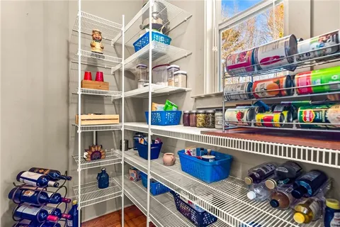 a bedroom with a bed dresser and a window