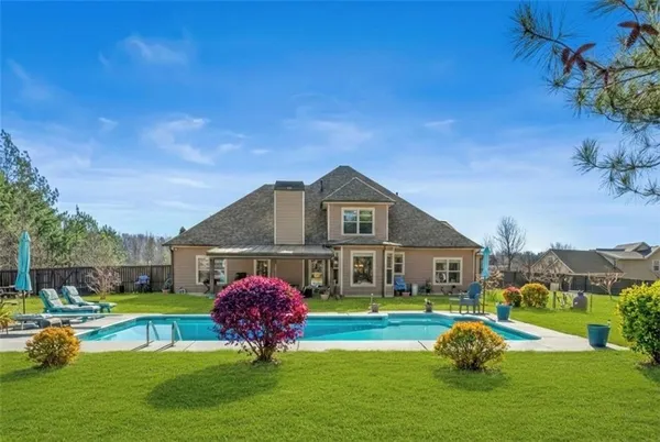 a front view of a house with garden