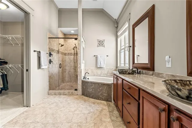 a bath room with a bath tub and a shower