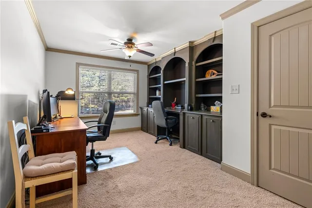 a view of a workspace with furniture