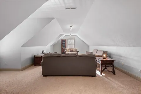 a view of a patio with a table chairs and a yard