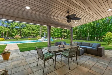 a view of a swimming pool with a patio