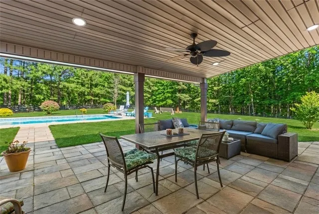 a view of a swimming pool with a patio