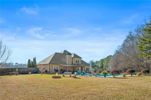 a view of a lake with houses in the back